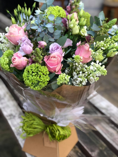 Garden Bouquet - A gorgeous hand tied bouquet filled with mixed seasonal flowers, all flowers will be arranged to create an "English Country" bouquet. Flowers may include, snapdragon, alstromeria, roses, stocks, delphinium.