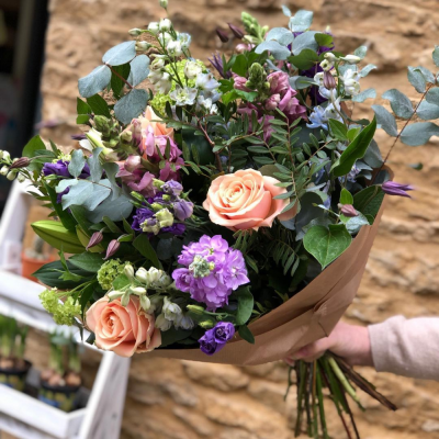 Cheerful Bouquet - A beautiful hand tied bouquet filled with mixed florist choice flowers in cheerful colours. Flowers may include roses, lisianthus, alstromeria, snapdragon and greenery to compliment. Flowers are subject to availability.